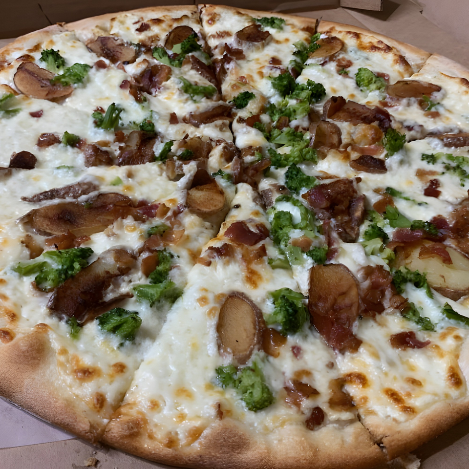 Gino's Pizza and Grill white pizza with broccoli, bacon, and potato slices.
